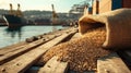 Grain sack spilling on dockside with shipping operations in background at sunset Royalty Free Stock Photo