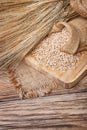 Grain in sacks and ears of wheat Royalty Free Stock Photo