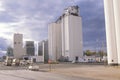 Grain silo co-op in KS with cloudy skies