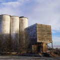 Grain silos and old mill made out of 2x6 staked on top of each other. Royalty Free Stock Photo