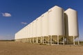Grain silos under a blue sky