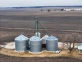 grain storage bins from the air with farm fields in the background Royalty Free Stock Photo
