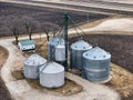 grain storage bins from the air with farm fields in the background Royalty Free Stock Photo