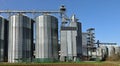 Grain storage bins with silos and elevator tower in the countryside Royalty Free Stock Photo