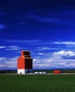 Grain truck drives away from grain elevator