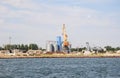 Grain warehouse seaport, Skadovsk, Ukraine. Port grain elevator with containers and industrial cargoes.