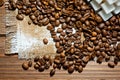 Grains of black coffee lying on a rough canvas. Background for coffee drinks Royalty Free Stock Photo