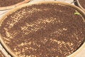 Grains of black pepper in basket