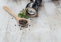 Grains of black Pepper in a wooden spoon Royalty Free Stock Photo