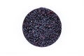 Grains of black rice in a round bowl on a white background, top view, close up Royalty Free Stock Photo