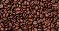 Grains coffee. Background from coffee beans. Roasted coffee beans. Brown coffee beans in whole background.