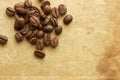 Grains of coffee on background of old book. Royalty Free Stock Photo