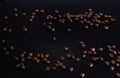 grains of coffee on black glass with reflection. Love coffee concept Royalty Free Stock Photo