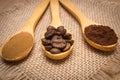 Grains, ground and instant coffee with wooden spoon on jute canvas Royalty Free Stock Photo