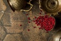 Grains of pomegranate on old paving stones Royalty Free Stock Photo