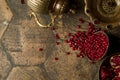 Grains of pomegranate on old paving stones Royalty Free Stock Photo