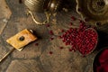 Grains of pomegranate on old paving stones Royalty Free Stock Photo