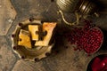 Grains of pomegranate on old paving stones Royalty Free Stock Photo