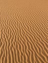 Grains of sand forming small waves on the dunes, panoramic view. Background, texture Royalty Free Stock Photo