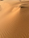 Grains of sand forming small waves on the dunes, panoramic view. Background, texture Royalty Free Stock Photo