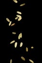 Grains of uncooked rice falling isolated Royalty Free Stock Photo