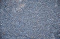 The grainy asphalt texture