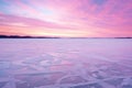 grainy ice surface under a pastel sunrise sky