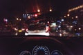 grainy style of car console, waiting in a traffic jam at night w