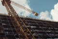 Grainy vintage construction site of a building with crane background