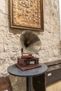 A gramophone or since the 1940s called a record player, is a device for the mechanical recording and reproduction of sound.