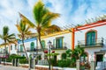 Gran Canaria Spain. December 6, 2018. Gran Canaria streets. Beautiful, vibrant multi-colored houses and palm trees in a seashore