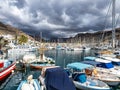 Gran Canaria, Spain - Feb 21, 2023: Colorful canarian fishing boats at the harbor in Puerto de Mogan, Gran Canaria,Spain Royalty Free Stock Photo