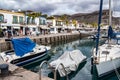 Gran Canaria, Spain - Feb 21, 2023: Colorful canarian fishing boats at the harbor in Puerto de Mogan, Gran Canaria,Spain Royalty Free Stock Photo