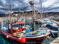 Gran Canaria, Spain - Feb 21, 2023: Colorful canarian fishing boats at the harbor in Puerto de Mogan, Gran Canaria,Spain Royalty Free Stock Photo