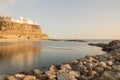 Gran Canaria, Spain. Long exposure photo during sunset on Amadores beach, smooth silky water, Puerto Rico town