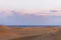 Walking through Maspalomas dunes at sunset