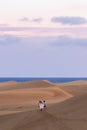 Walking through Maspalomas dunes at sunset