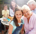 Gran and I. Portrait of a granddaughter and grandmother embracing one another at a family lunch - Copyspace. Royalty Free Stock Photo