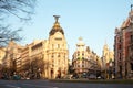 Gran Via and the iconic Metropolis Building sourrounded by trational spanish architecture at sunrise