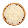 Grana Padano cheese flakes, Italian hard cheese, in a wooden bowl