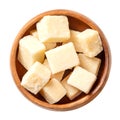 Grana Padano cheese cubes, Italian hard cheese chunks, in a wooden bowl Royalty Free Stock Photo