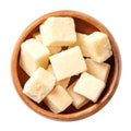 Grana Padano cheese cubes, Italian hard cheese chunks, in a wooden bowl