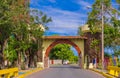 GRANADA, NICARAGUA, MAY, 14, 2018: Beautiful outdoor view of stoned arch located at the enter of the city with roof in