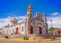 GRANADA, NICARAGUA, MAY, 14, 2018: Outdoor gorgeous view of the facade of white Spanish colonial Guadalupe church