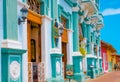 GRANADA, NICARAGUA, MAY, 14, 2018: Outdoor view of facade buildings with turquoise wall and wooden door in the historic