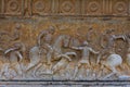 Granada, Spain Ã¢â¬â 2019. Beautiful relief wall sculpture depicting the soldiers fighting on horseback on the ancient wall of