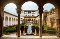 GRANADA, SPAIN - FEBRUARY 10, 2015: An archway to patio with fountains and cutted brushes at Generalife Gardens of Alhambra palace Royalty Free Stock Photo