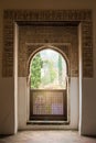 GRANADA, SPAIN - FEBRUARY 10, 2015: An archway with a view to a garden at Generalife Gardens of Alhambra palace, Granada Royalty Free Stock Photo