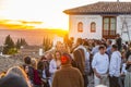 Visitors watching the sunset and observing the Alhambra Palace from Mirador de San Nicolas, Granada, Spain