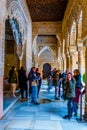 GRANADA, SPAIN, JANUARY 3, 2016: people are enjoying view of the court of lions inside of the alhambra palace in spanish